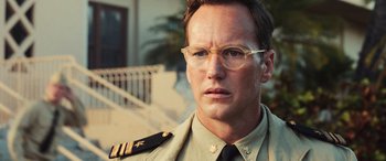 Movie still from “Midway” (2019), directed by Roland Emmerich – A person wearing glasses and a uniform; Close Up shot, Low angle