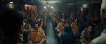 Movie still from “Midway” (2019), directed by Roland Emmerich – A group of men sitting in a room; Wide shot, High angle