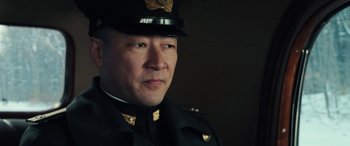 Movie still from “Midway” (2019), directed by Roland Emmerich – A person wearing a uniform; Close Up shot, Low angle