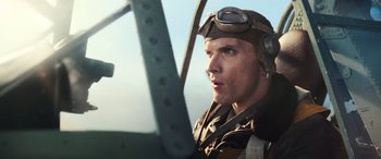 Movie still from “Midway” (2019), directed by Roland Emmerich – A person wearing a helmet; Close Up shot, Low angle