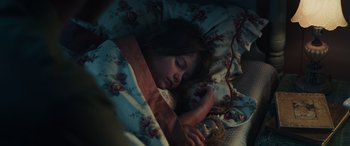 Movie still from “Midway” (2019), directed by Roland Emmerich – A child sleeping in a bed with a teddy bear; Close Up shot, High angle