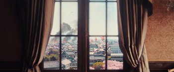 Movie still from “Midway” (2019), directed by Roland Emmerich – A view of a city from a window; Extreme Wide shot, High angle