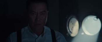 Movie still from “Midway” (2019), directed by Roland Emmerich – A person wearing a white shirt; Close Up shot, Low angle