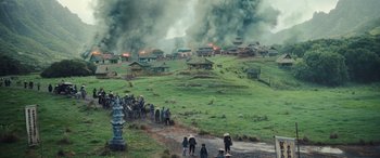 Movie still from “Midway” (2019), directed by Roland Emmerich – A group of people standing on top of a grass covered field; Extreme Wide shot, High angle