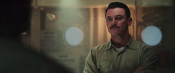 Movie still from “Midway” (2019), directed by Roland Emmerich – A person with a mustache; Close Up shot, Over the shoulder angle