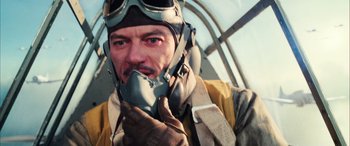 Movie still from “Midway” (2019), directed by Roland Emmerich – A person wearing a helmet and gloves; Close Up shot, Low angle