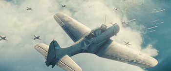 Movie still from “Midway” (2019), directed by Roland Emmerich – An airplane flying through the air with other planes in the background; Extreme Wide shot, Overhead angle