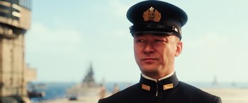 Movie still from “Midway” (2019), directed by Roland Emmerich – A person wearing a uniform; Close Up shot, Low angle