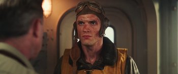 Movie still from “Midway” (2019), directed by Roland Emmerich – A person wearing a pilot's hat; Close Up shot, Low angle