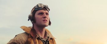Movie still from “Midway” (2019), directed by Roland Emmerich – A man in a pilot's outfit looking up; Close Up shot, Low angle