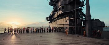 Movie still from “Midway” (2019), directed by Roland Emmerich – A group of people standing on the deck of an aircraft carrier; Extreme Wide shot, High angle