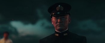 Movie still from “Midway” (2019), directed by Roland Emmerich – A person wearing a uniform; Close Up shot, Low angle