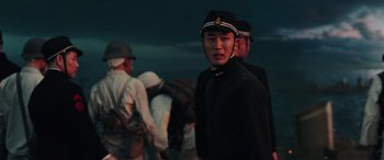 Movie still from “Midway” (2019), directed by Roland Emmerich – A group of men standing next to each other; Medium shot, Low angle