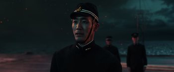 Movie still from “Midway” (2019), directed by Roland Emmerich – A man wearing a uniform and a hat; Close Up shot, Low angle