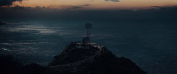 Movie still from “Midway” (2019), directed by Roland Emmerich – A view of the ocean from a hill at night; Extreme Wide shot, High angle