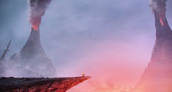 Movie still from “Minions” (2015), directed by Pierre Coffin – A person sitting on a cliff looking out at the sky; Extreme Wide shot, Low angle