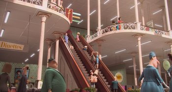 Movie still from “Minions” (2015), directed by Pierre Coffin – A group of people riding up an escalator in a building; Extreme Wide shot, High angle