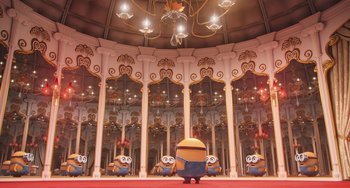 Movie still from “Minions” (2015), directed by Pierre Coffin – A group of minions standing in front of a mirror; Extreme Wide shot, High angle