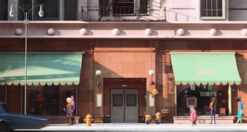 Movie still from “Minions” (2015), directed by Pierre Coffin – A building that has a fire hydrant in front of it; Extreme Wide shot, Low angle