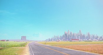Movie still from “Minions” (2015), directed by Pierre Coffin – An image of an empty road in the middle of a field; Extreme Wide shot, High angle
