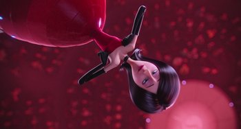 Movie still from “Minions” (2015), directed by Pierre Coffin – A woman holding a pair of scissors in her hand; Medium shot, Low angle