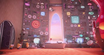 Movie still from “Minions” (2015), directed by Pierre Coffin – A room filled with lots and lots of computer equipment; Extreme Wide shot, Overhead angle