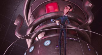 Movie still from “Minions” (2015), directed by Pierre Coffin – A man standing on top of a building holding a remote control; Medium shot, Low angle