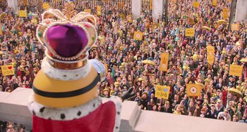 Movie still from “Minions” (2015), directed by Pierre Coffin – A large crowd of people gathered in a large room; Extreme Wide shot, High angle
