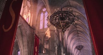 Movie still from “Minions” (2015), directed by Pierre Coffin – A chandelier hanging from the ceiling of a church; Extreme Wide shot, Low angle