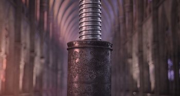 Movie still from “Minions” (2015), directed by Pierre Coffin – An ornate metal pillar in the middle of an archway; Extreme Close Up shot, High angle