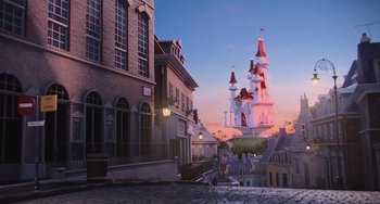 Movie still from “Minions” (2015), directed by Pierre Coffin – A view of a street and a building with a clock tower in the background; Extreme Wide shot, Low angle