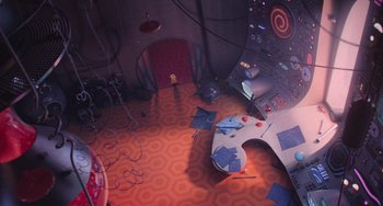 Movie still from “Minions” (2015), directed by Pierre Coffin – A computer desk with a computer monitor on top of it; Extreme Wide shot, Overhead angle