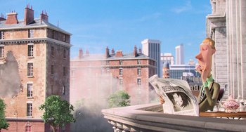 Movie still from “Minions” (2015), directed by Pierre Coffin – A view of a city from a balcony with smoke coming out of the building; Wide shot, Low angle