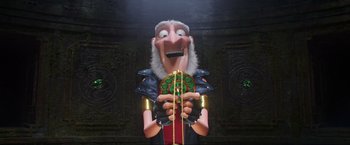 Movie still from “Minions: The Rise of Gru” (2022), directed by Jonathan del Val – A cartoon character is holding something in his hands; Medium shot, Overhead angle