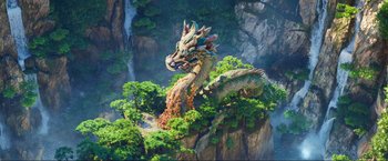 Movie still from “Minions: The Rise of Gru” (2022), directed by Jonathan del Val – A dragon is sitting on top of a mountain; Extreme Wide shot, High angle