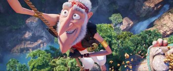 Movie still from “Minions: The Rise of Gru” (2022), directed by Jonathan del Val – An animated character is standing in a forest; Wide shot, Overhead angle