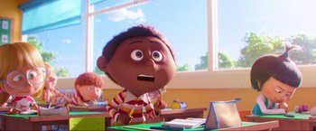 Movie still from “Minions: The Rise of Gru” (2022), directed by Jonathan del Val – A character in a scene from inside out; Close Up shot, Over the shoulder angle