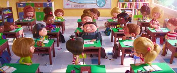 Movie still from “Minions: The Rise of Gru” (2022), directed by Jonathan del Val – A group of children sitting at desks in a classroom; Wide shot, High angle
