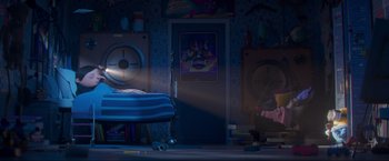 Movie still from “Minions: The Rise of Gru” (2022), directed by Jonathan del Val – A room with a bed and a poster on the wall; Wide shot, High angle