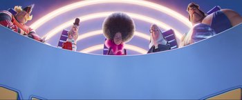 Movie still from “Minions: The Rise of Gru” (2022), directed by Jonathan del Val – A group of people standing next to each other in a room; Wide shot, Low angle