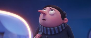 Movie still from “Minions: The Rise of Gru” (2022), directed by Jonathan del Val – An image of an animated character looking up at the sky; Close Up shot, Low angle