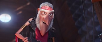 Movie still from “Minions: The Rise of Gru” (2022), directed by Jonathan del Val – An animated character is wearing a red bandana; Close Up shot, Over the shoulder angle