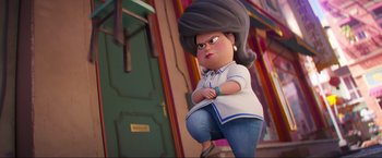 Movie still from “Minions: The Rise of Gru” (2022), directed by Jonathan del Val – An animated woman is standing in front of a door; Medium shot, Low angle