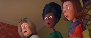 Movie still from “Minions: The Rise of Gru” (2022), directed by Jonathan del Val – A group of people standing next to each other in a room; Close Up shot, Low angle