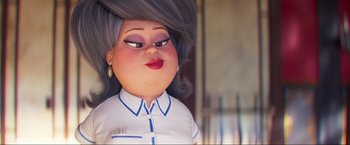Movie still from “Minions: The Rise of Gru” (2022), directed by Jonathan del Val – An animated woman with gray hair and blue eyes; Close Up shot, Over the shoulder angle