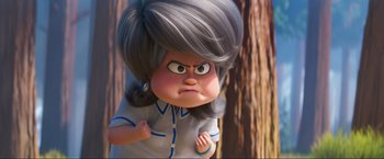 Movie still from “Minions: The Rise of Gru” (2022), directed by Jonathan del Val – An animated character with gray hair is looking angry; Close Up shot, Over the shoulder angle