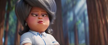 Movie still from “Minions: The Rise of Gru” (2022), directed by Jonathan del Val – A doll's face with hair blowing in the wind; Close Up shot, Over the shoulder angle