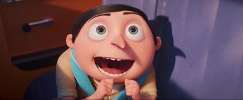 Movie still from “Minions: The Rise of Gru” (2022), directed by Jonathan del Val – A character with a surprised look on his face; Close Up shot, Overhead angle