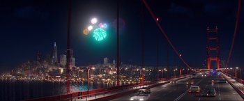 Movie still from “Minions: The Rise of Gru” (2022), directed by Jonathan del Val – Fireworks are being displayed over a city at night; Extreme Wide shot, High angle