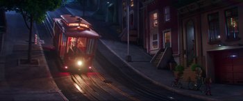 Movie still from “Minions: The Rise of Gru” (2022), directed by Jonathan del Val – A train is coming down the tracks at night; Extreme Wide shot, High angle